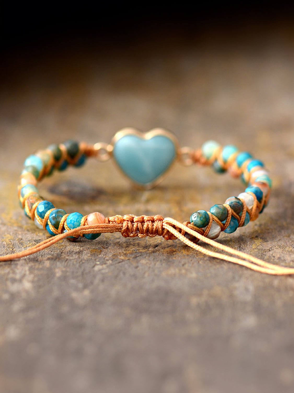 NEWYORKLISTED Valentineās Day Specials: Bracelet with turquoise heart charm on a textured surface