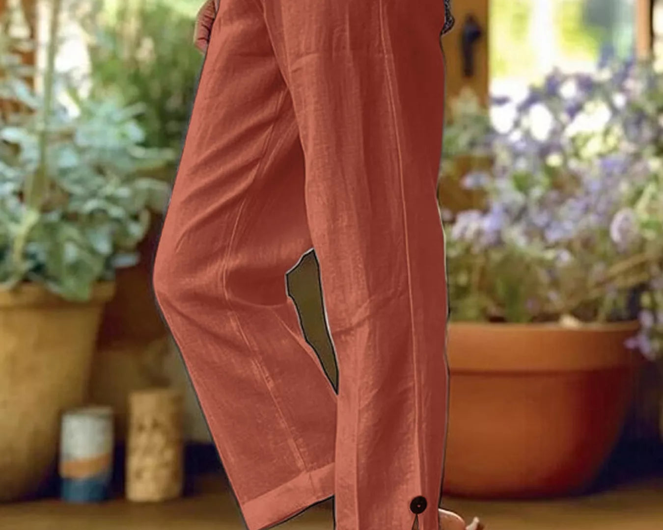 NEWYORKLISTED STYLE COLLECTION: Person wearing pink pants with a blurred indoor background