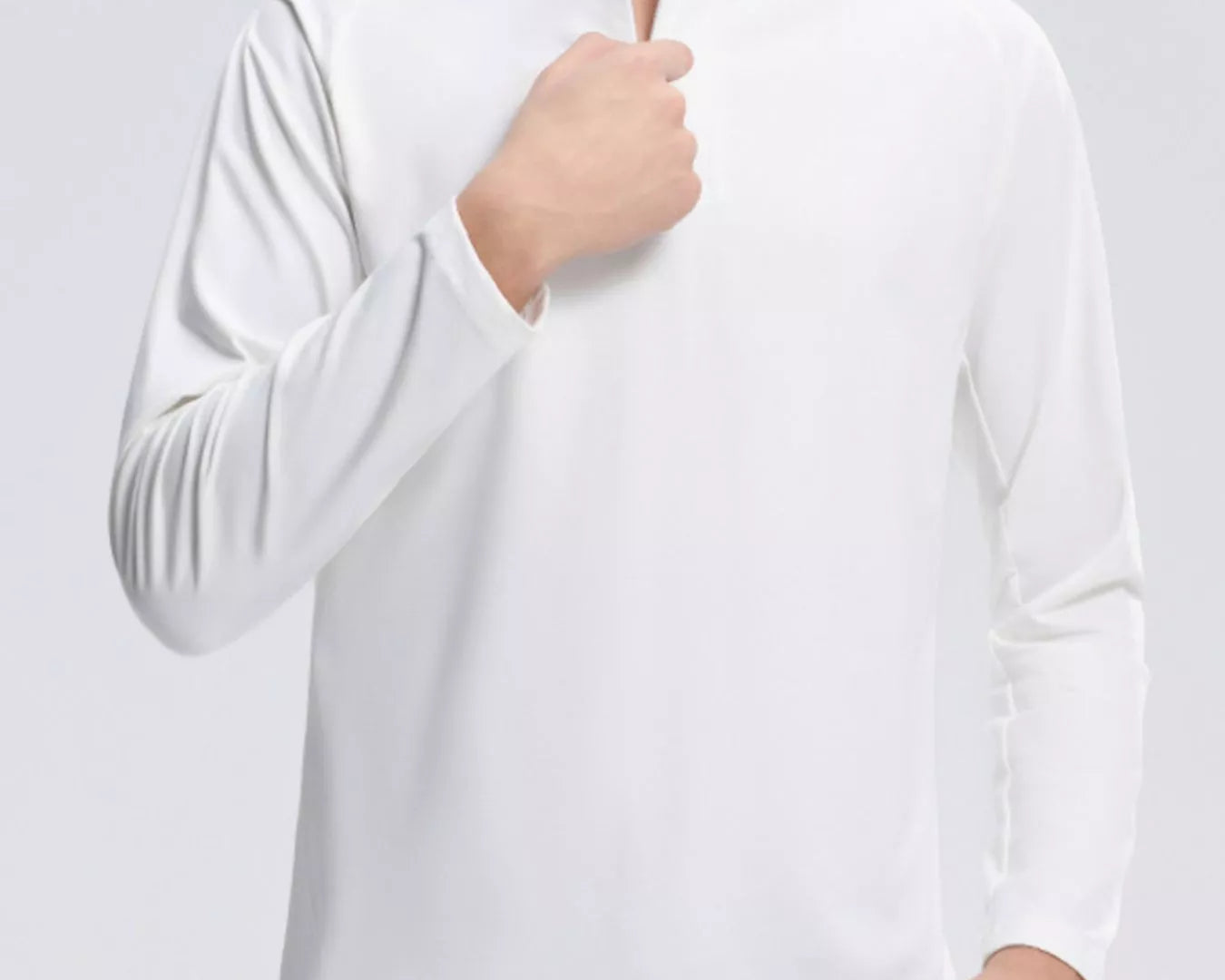 NEWYORKLISTED ATLAS MEN's COLLECTION: Person wearing a white long-sleeve shirt on a light gray background