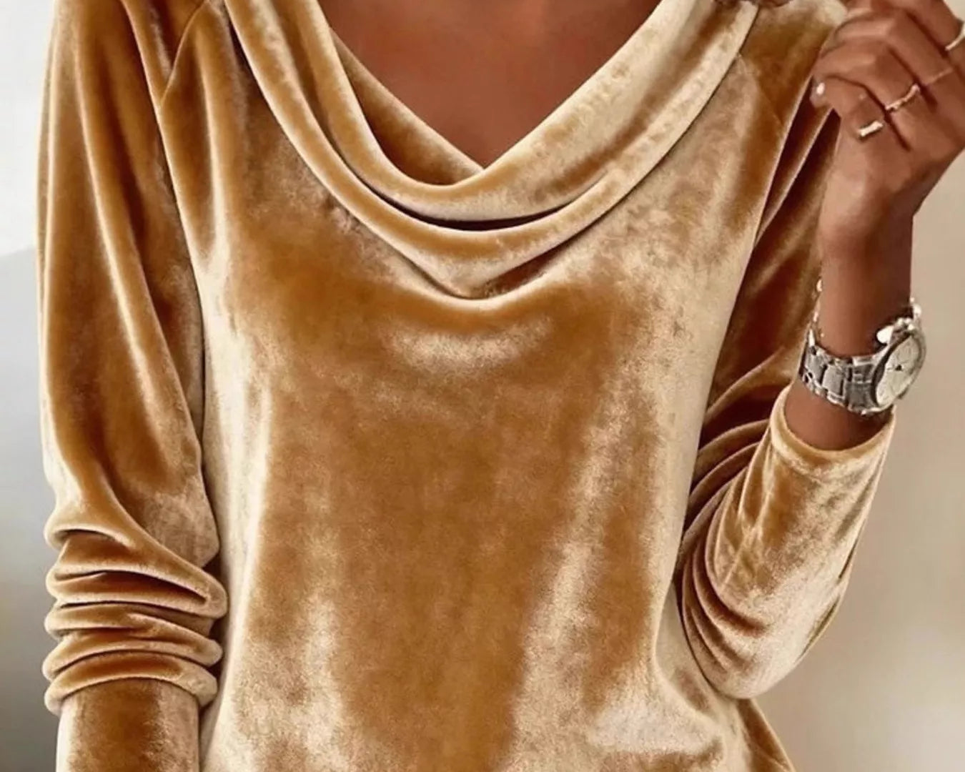 NEWYORKLISTED STYLE COLLECTION: Gold velvet top worn by a person with a neutral background
