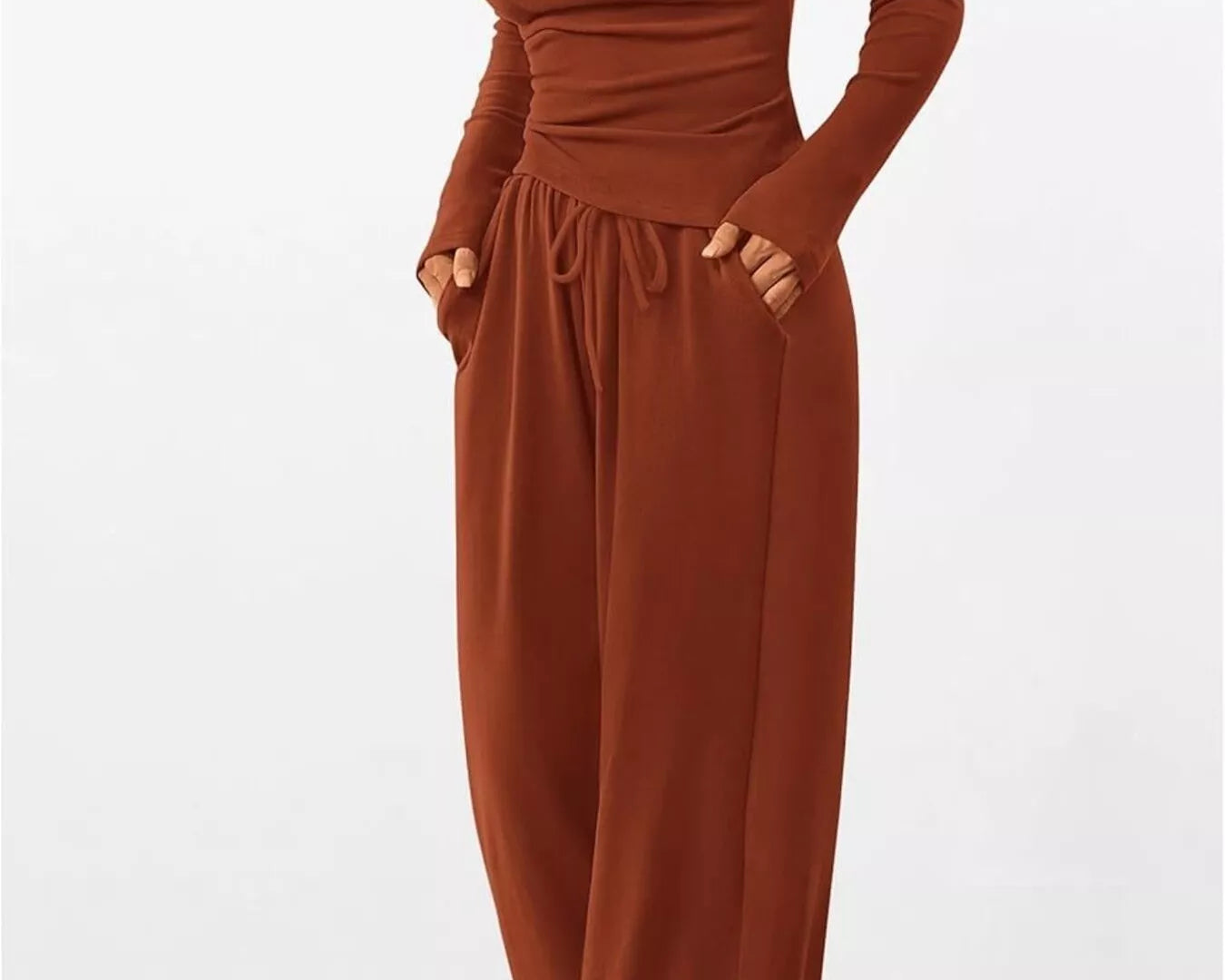 Brown jumpsuit with long sleeves on a white background