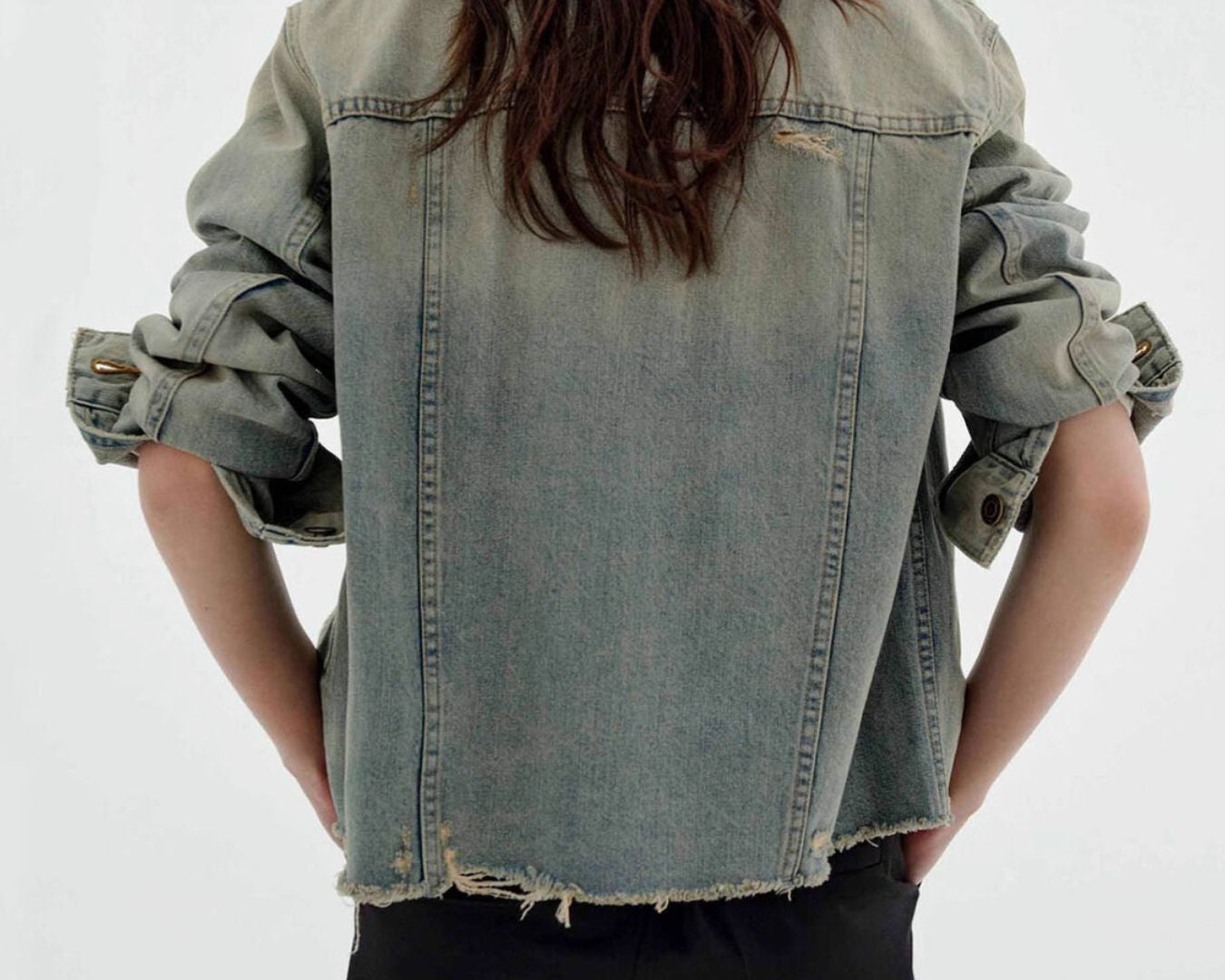 NEWYORKLISTED STYLE COLLECTION: Person wearing a light blue denim jacket on a white background