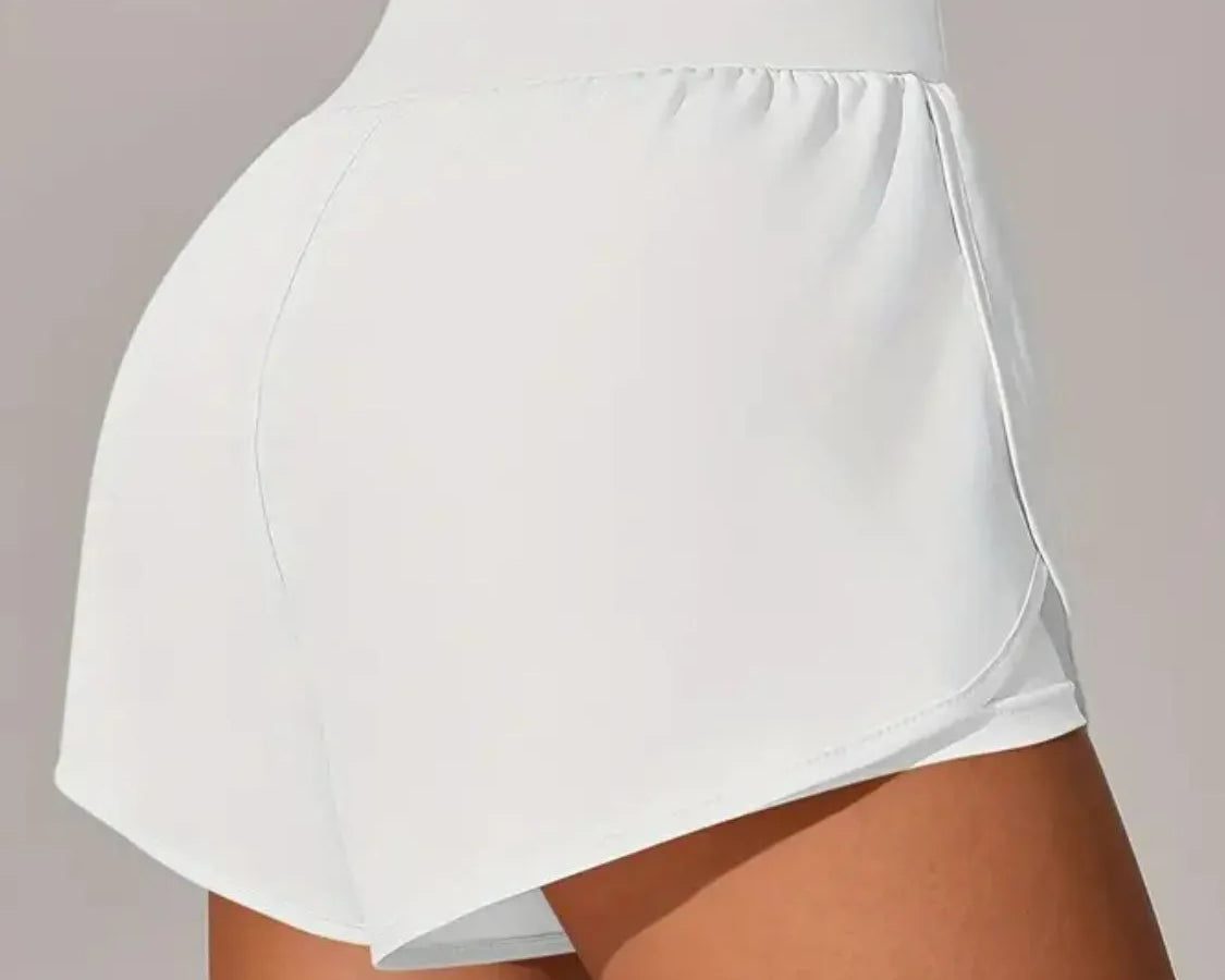 NEWYORKLISTED Activewear: White athletic skirt worn by a person on a plain background