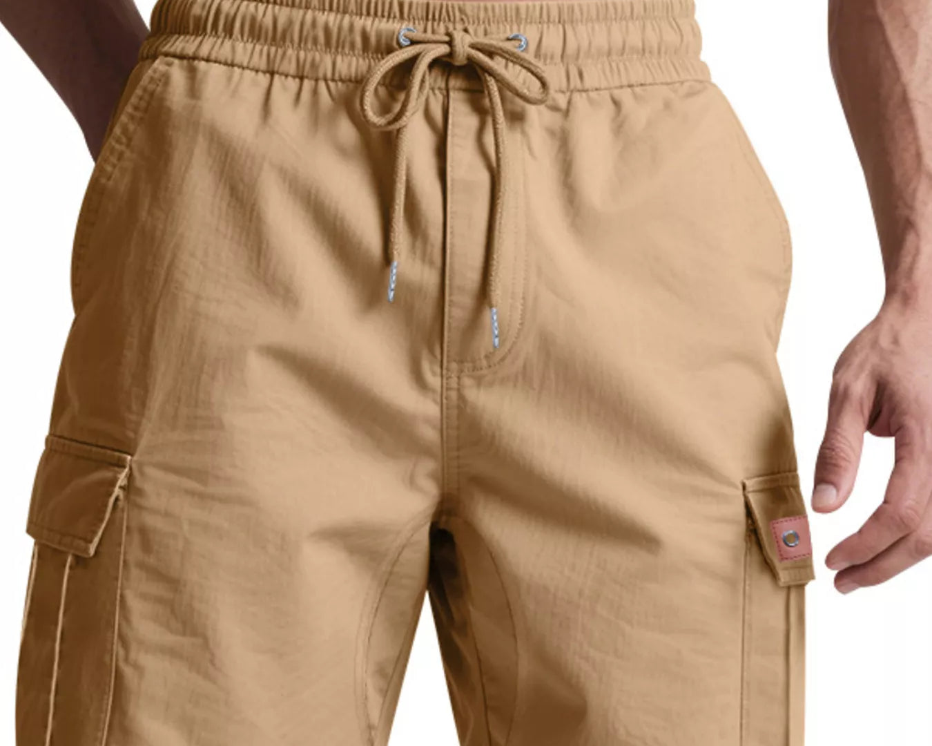 NEWYORKLISTED ATLAS MEN'S COLLECTION: Beige cargo shorts worn by a person on a white background