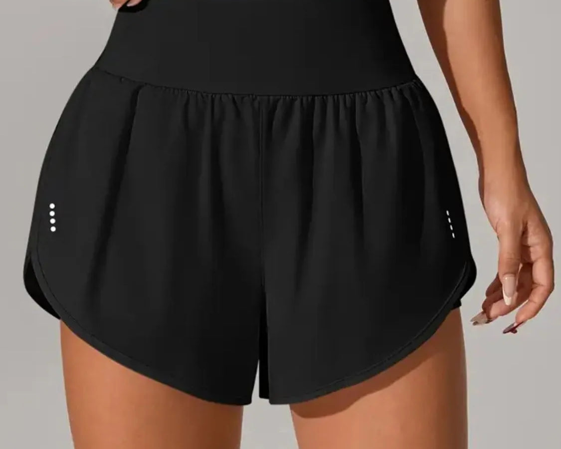 NEWYORKLISTED Activewear: Black athletic shorts worn by a person on a neutral background