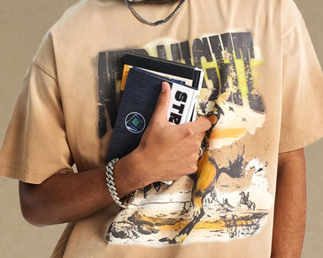 NEWYORKLISTED ATLAS MEN'S COLLECTION: Person wearing a beige t-shirt with graphic design, holding a phone case, on a beige background