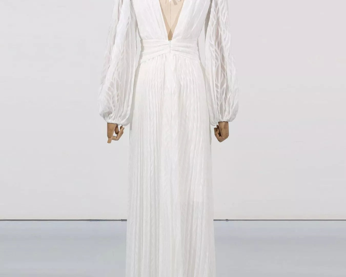 NEWYORKLISTED STYLE COLLECTION: White dress on a mannequin against a white background