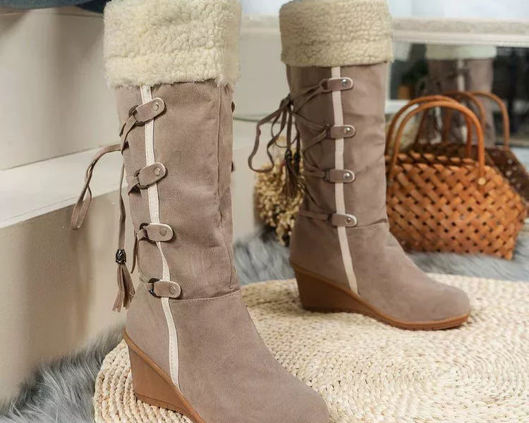 NEWYORKLISTED SHOE COLLECTION: Brown suede boots with fur trim worn by a person sitting on a bench.