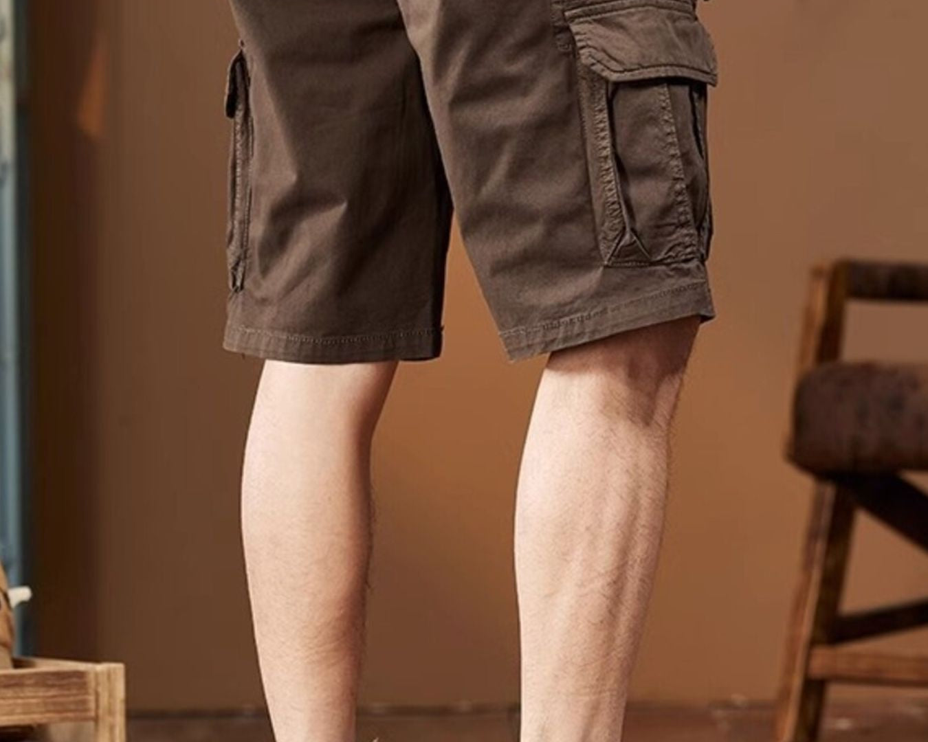 NEWYORKLISTED ATLAS MEN's COLLECTION: Brown cargo shorts worn by a person with a blurred background