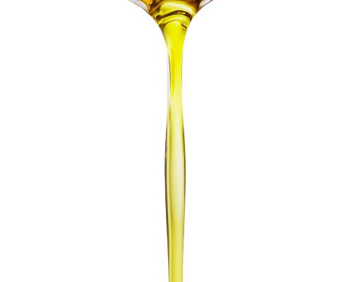 Spoon pouring a stream of NEWYORKLISTED Castor Oil likely oil, on a white background