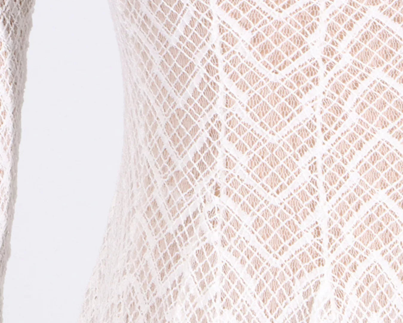 NEWYORKLISTED STYLE COLLECTION: Close-up of a textured beige fabric with a diamond pattern on a white background