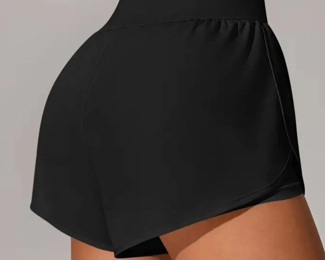 NEWYORKLISTED Activewear: Black athletic shorts worn by a person on a plain background