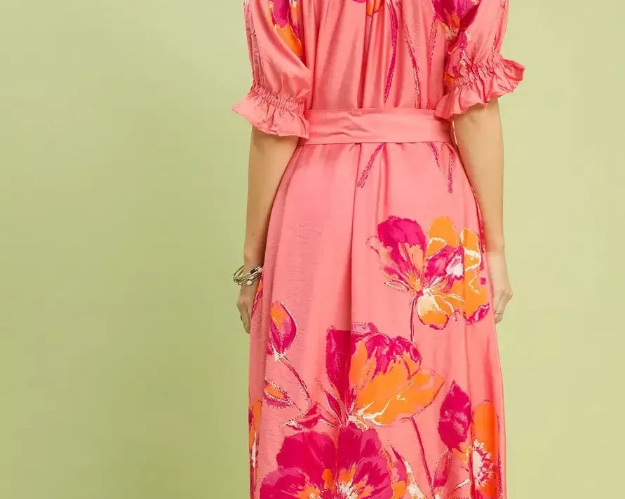 NEWYORKLISTED STYLE COLLECTION: Woman wearing a pink floral dress against a light green background