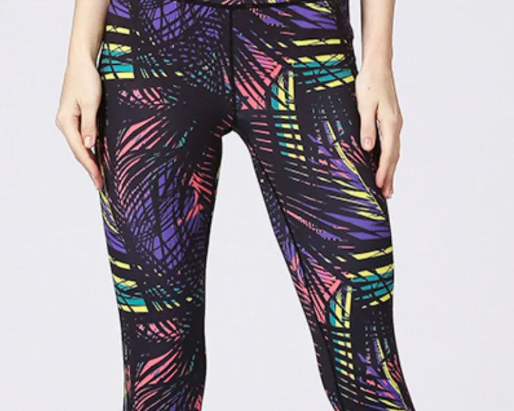 NEWYORKLISTED ACTIVEWEAR COLLECTION: Multicolored patterned leggings on a plain background