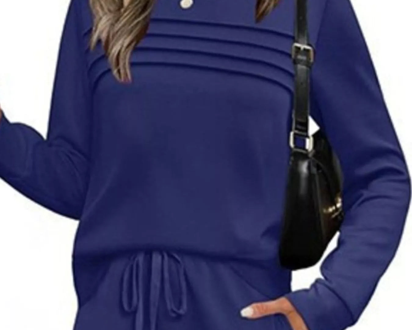 NEWYORKLISTED COMFORT COLLECTION: Woman wearing a blue outfit with a black handbag on a white background