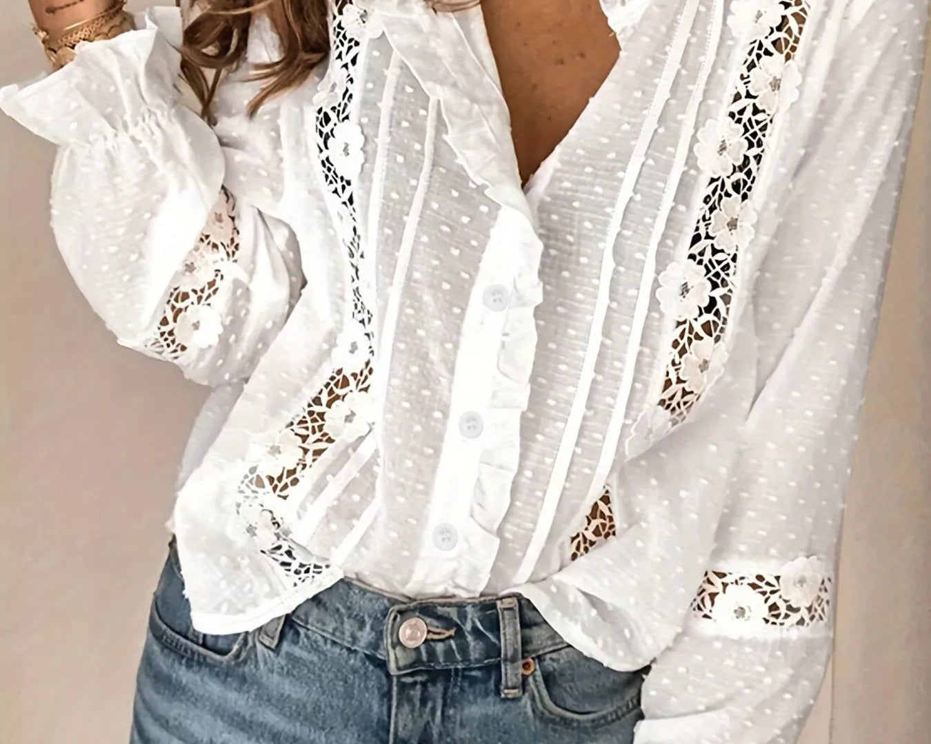NEWYORKLISTED STYLE COLLECTION: White blouse with lace details worn by a person against a neutral background