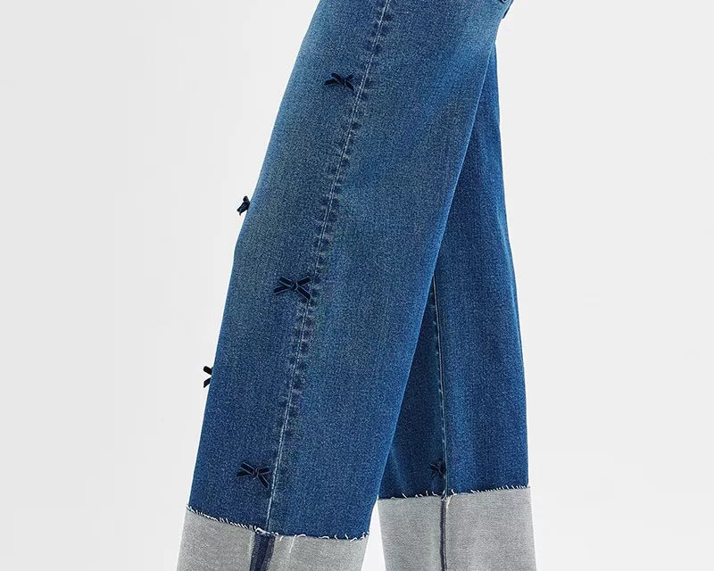 NEWYORKLISTED STYLE COLLECTION: Blue jeans with a gray hem on a white background