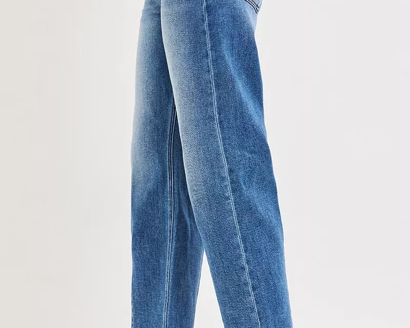 NEWYORKLISTED DENIM COLLECTION: Blue jeans worn by a person on a white background