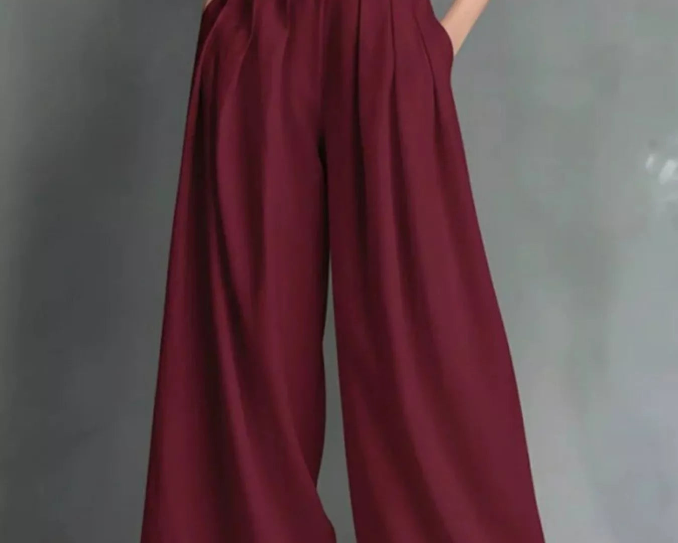 NEWYORKLISTED STYLE COLLECTION: Maroon wide-leg pants with a black top and white belt on a gray background