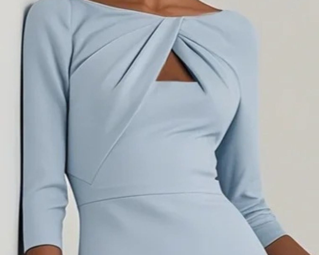 NEWYORKLISTED STYLE COLLECTION: Light blue dress with a knot detail on a plain background