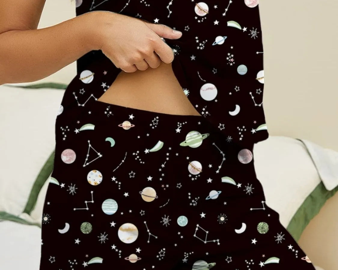 NEWYORKLISTED Intimate Apparel: Person wearing a black sleeveless top and shorts with space-themed pattern on a neutral background