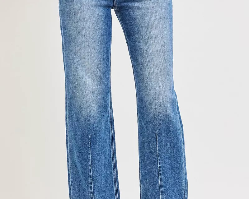 NEWYORKLISTED DENIM COLLECTION: Blue jeans worn by a person on a white background