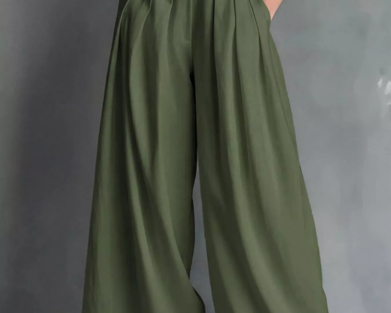NEWYORKLISTED STYLE COLLECTION: Green wide-leg pants with a white belt on a gray background