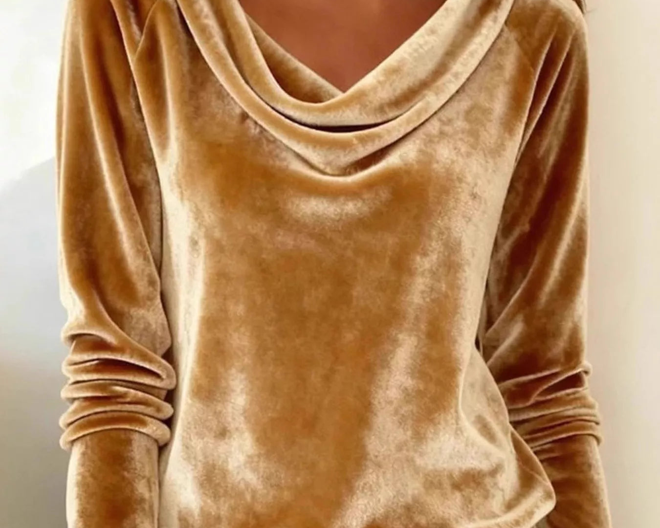 NEWYORKLISTED STYLE COLLECTION: Brown velvet long-sleeve top worn by a person with light blue jeans.