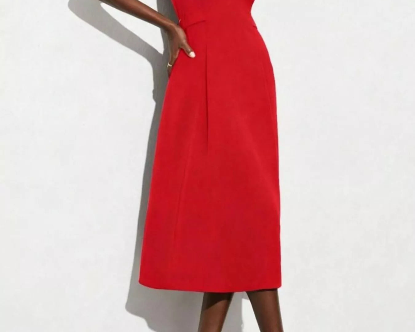 NEWYORKLISTED STYLE COLLECTION: Red dress worn by a model on a white background