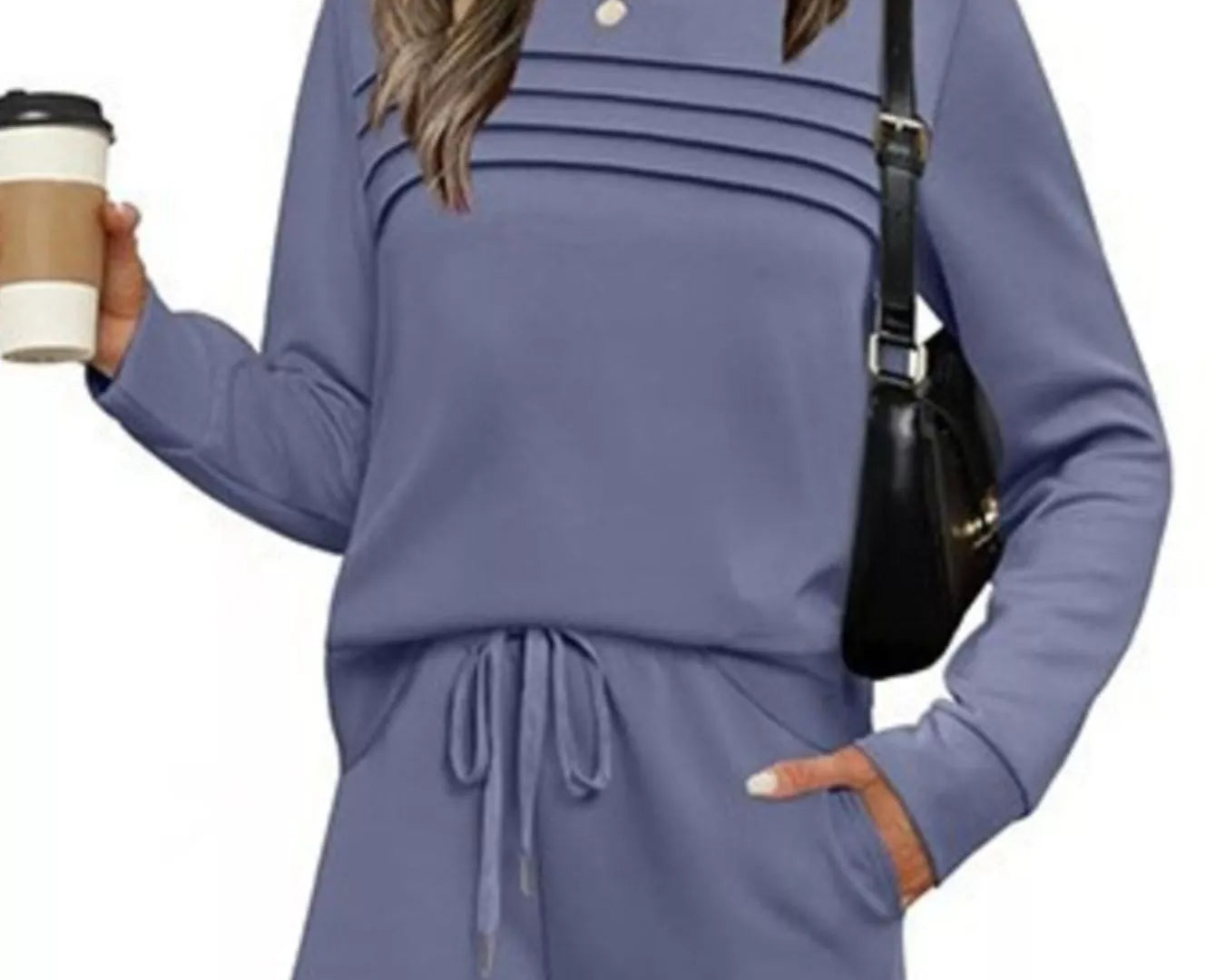 NEWYORKLISTED COMFORT COLLECTION: Woman wearing a blue outfit holding a coffee cup and black handbag on a white background