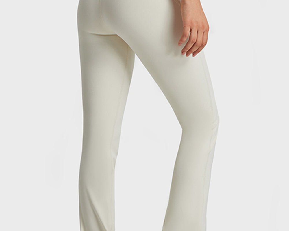 NEWYORKLISTED ACTIVEWEAR COLLECTION: Person wearing light-colored pants on a white background