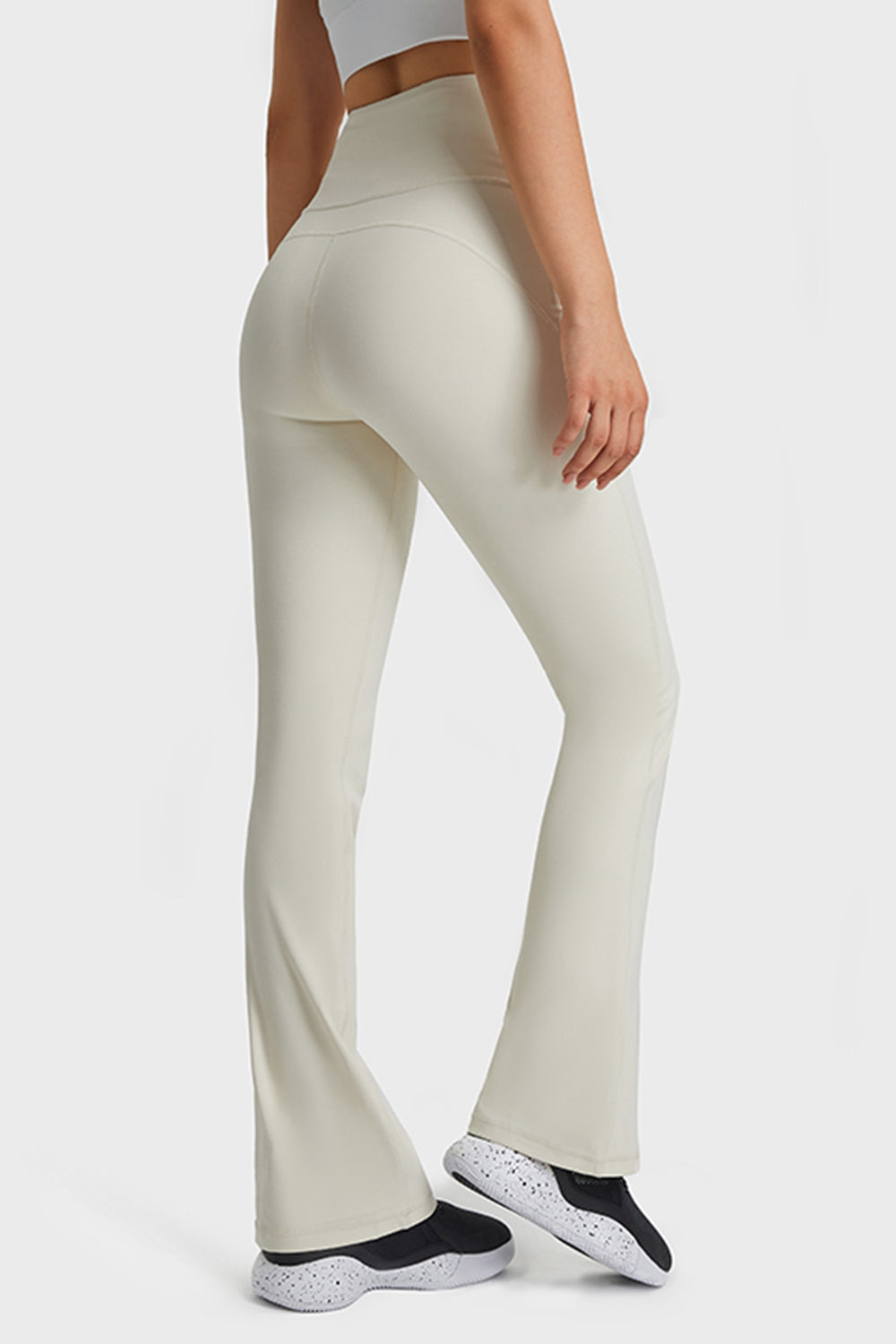 NEWYORKLISTED ACTIVEWEAR COLLECTION: Person wearing light-colored pants on a white background