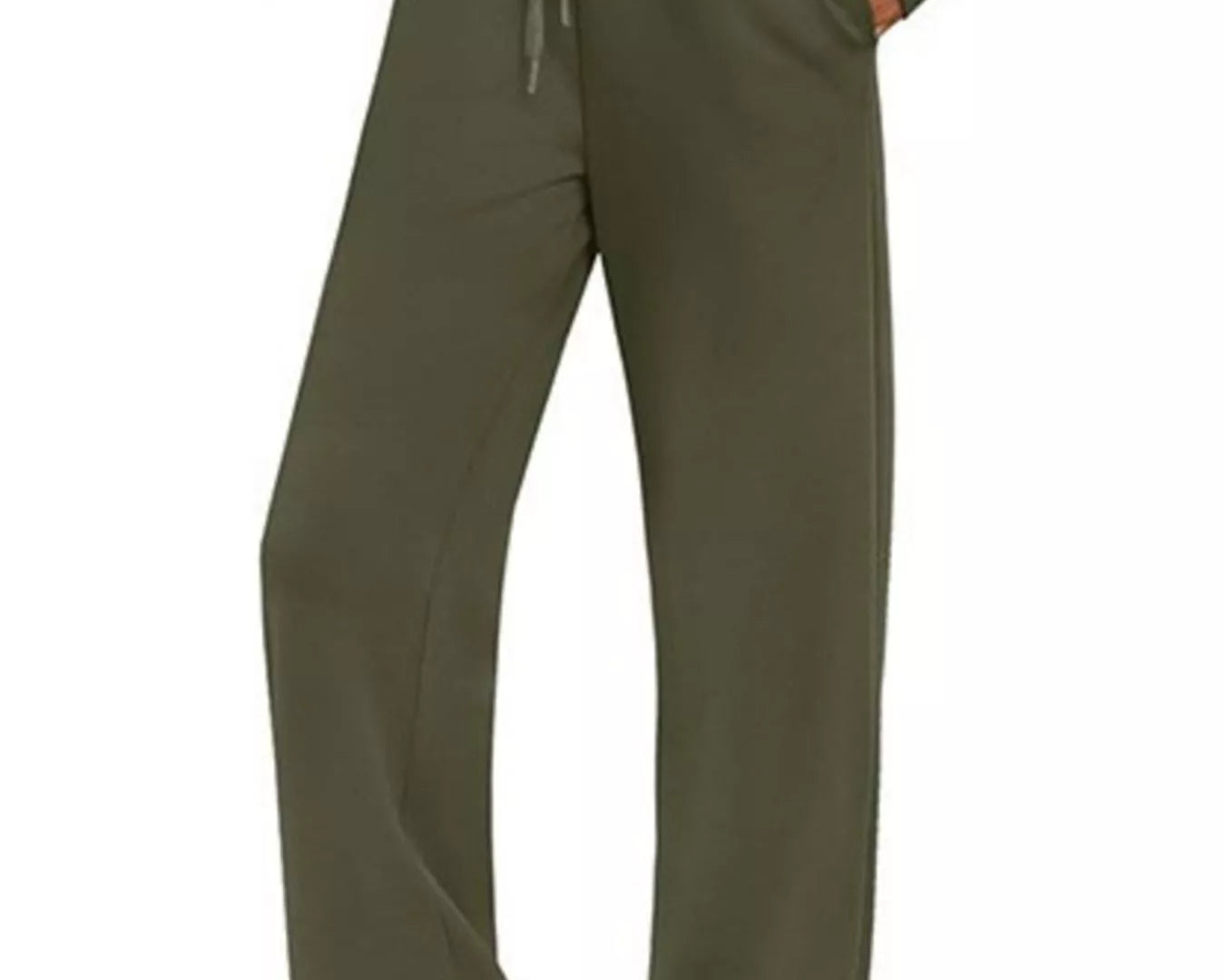 NEWYORKLISTED COMFORT COLLECTION: Green tracksuit worn by a person on a white background