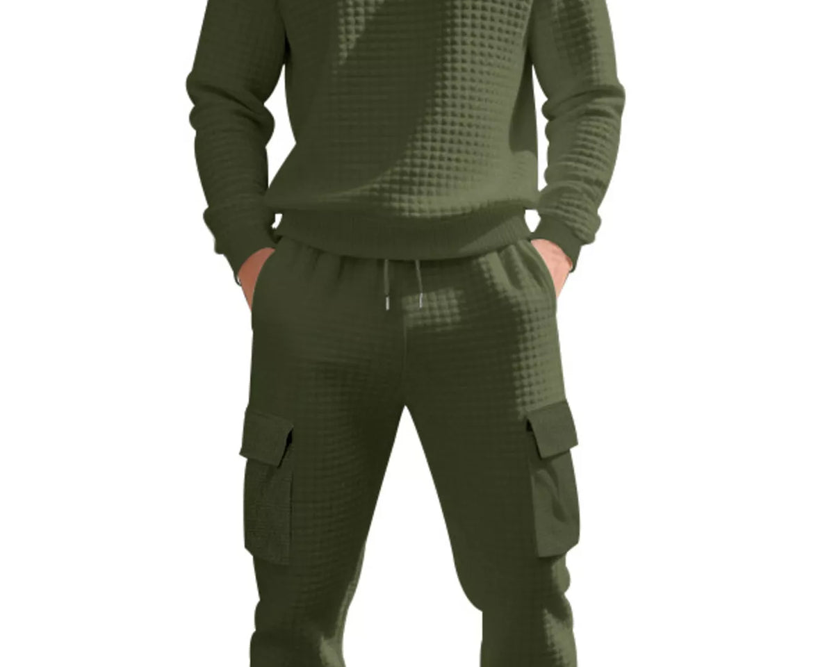 NEWYORKLISTED ATLAS MEN'S COLLECTION: A man wearing a matching olive green waffle-knit sweatshirt and jogger pants set with cargo pockets, shown against a plain white background.