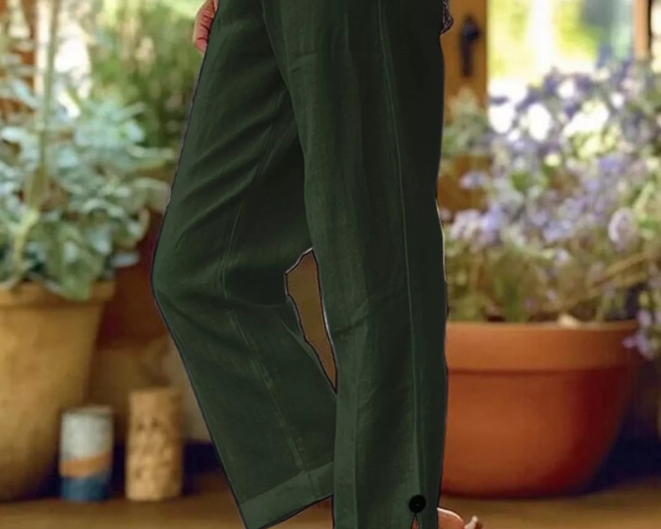 NEWYORKLISTED STYLE COLLECTION: Person wearing green pants with a blurred indoor background