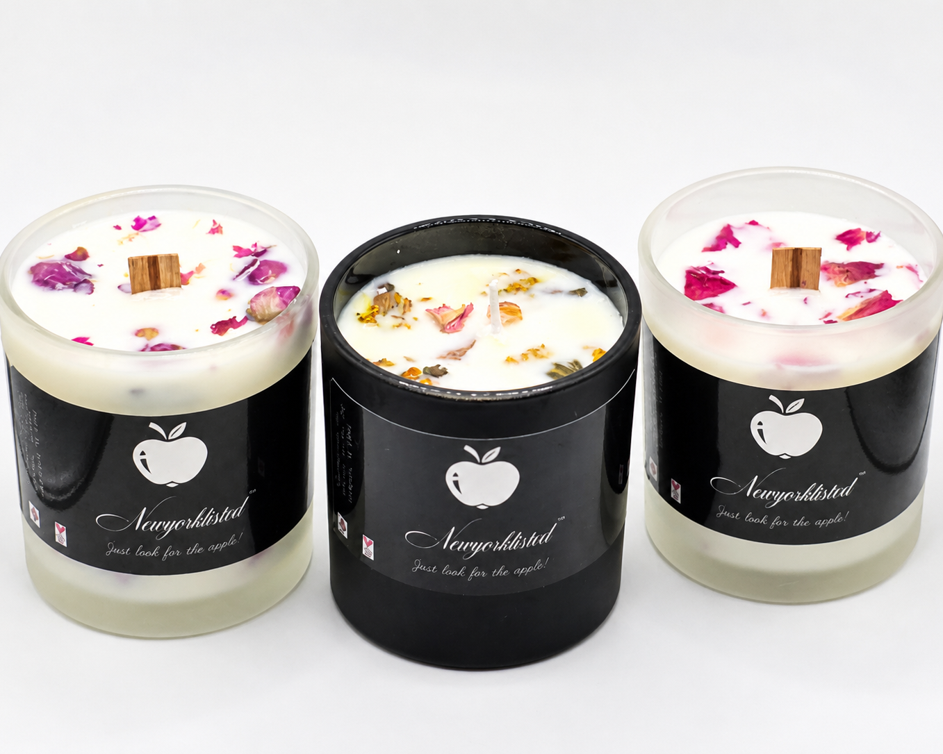 NEWYORKLISTED LUXURY SENSORY COLLECTION™: Botanical Wood Wick Candle – Hand-Poured Luxury Spa Candle: Three candles with decorative elements in black containers on a white background