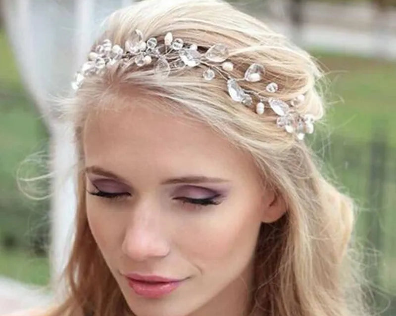 NEWYORKLISTED ELEGANT BRIDE COLLECTION: Silver Crystal Wedding Tiara Crown: Woman wearing a decorative headpiece with a blurred outdoor background