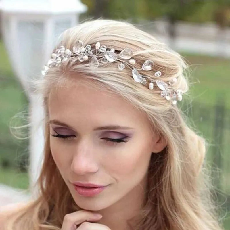 NEWYORKLISTED ELEGANT BRIDE COLLECTION: Silver Crystal Wedding Tiara Crown: Woman wearing a decorative headpiece with a blurred outdoor background