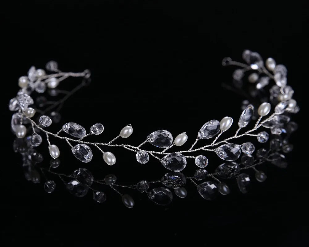 Silver hair vine with beads on a black background