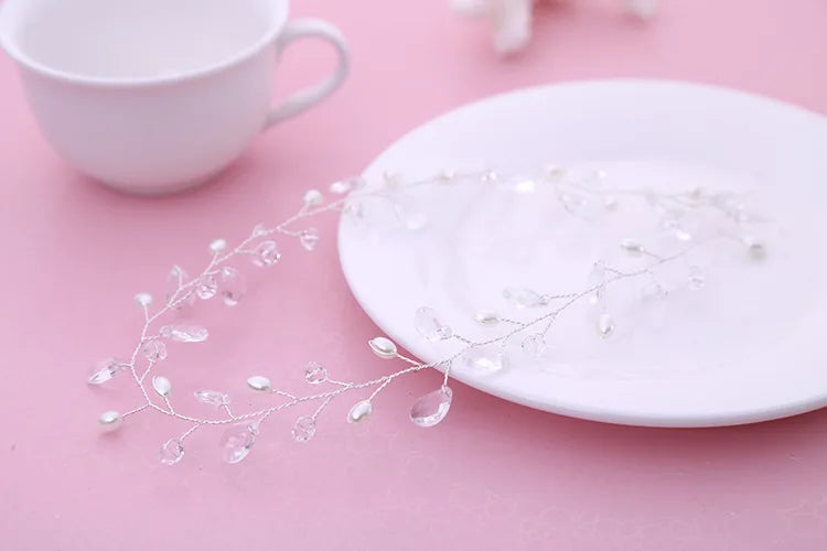 White ceramic plate with decorative elements on a pink surface