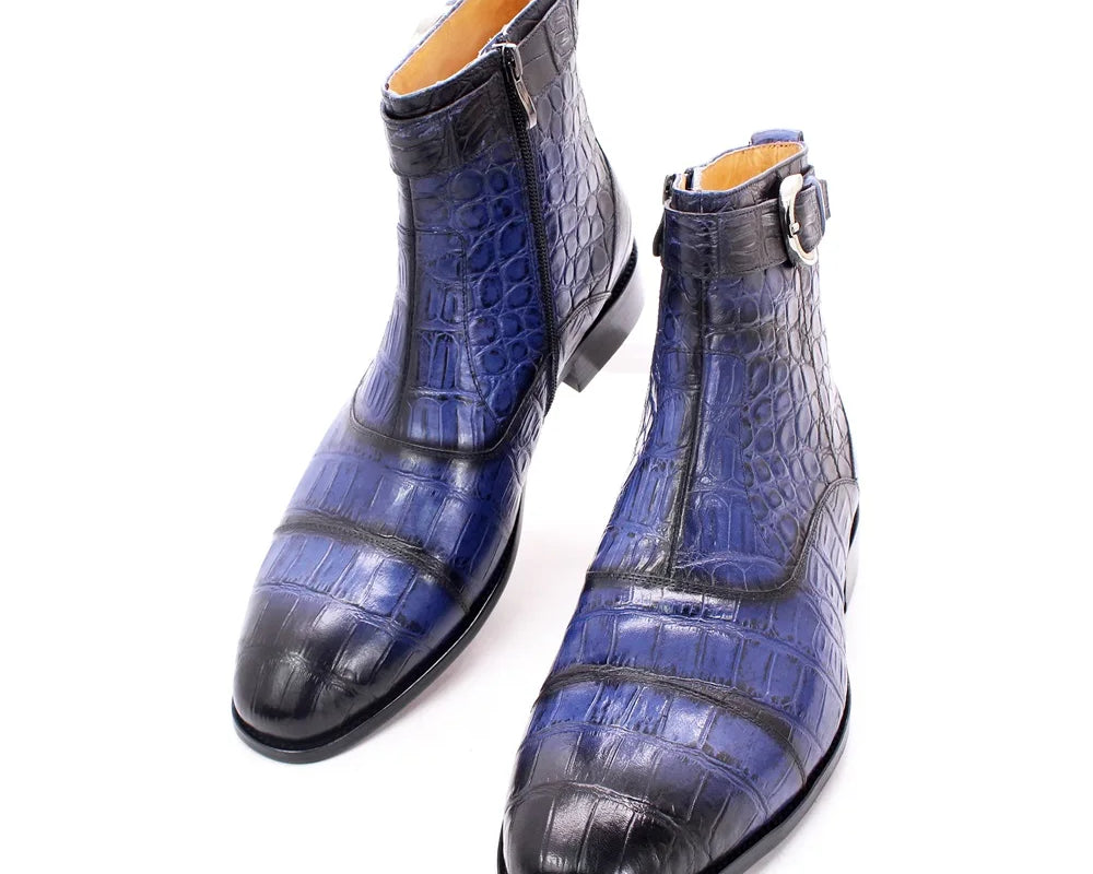 NEWYORKLISTED MEN'S COLLECTION: Blue crocodile-patterned leather boots on a white background
