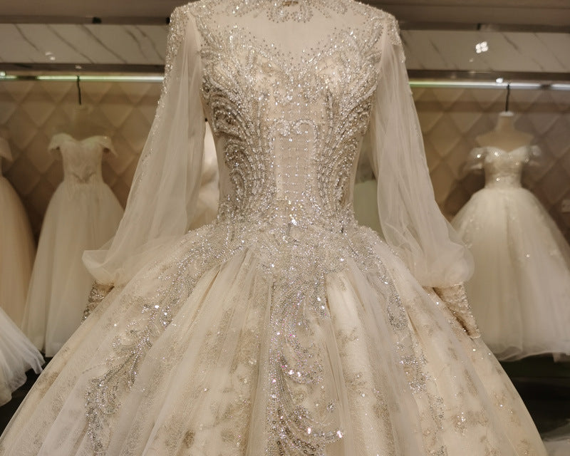 NEWYORKLISTED ELEGANT BRIDE COLLECTION: Regal Long-Sleeve Ball Gown Wedding Dress with Illusion Neckline & Long Train - NEWYORKLISTED