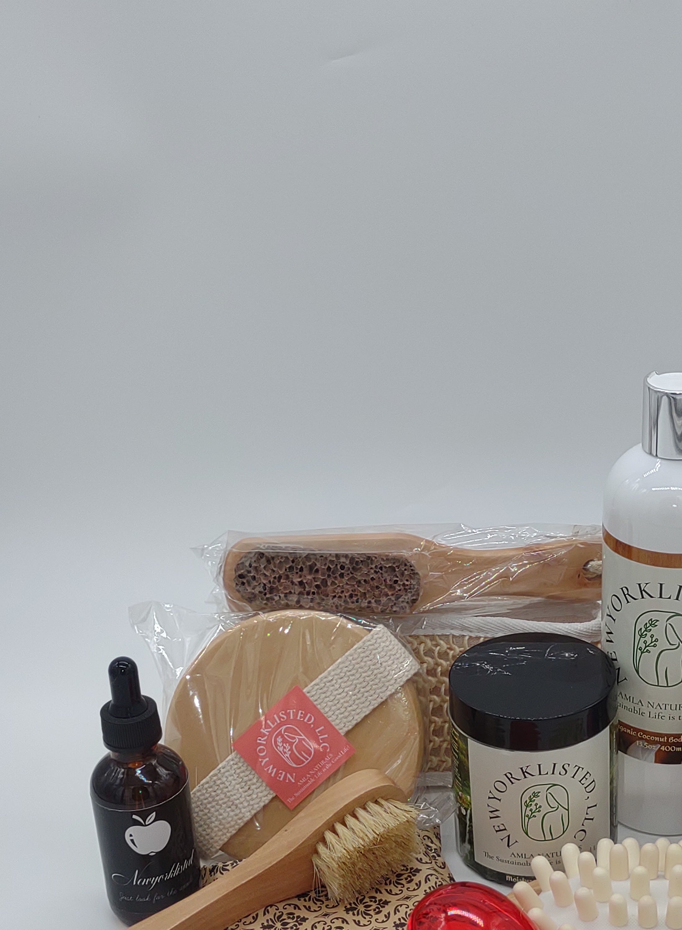NEWYORKLISTED Valentine’s Day Luxury Spa Gift Basket, Collection of natural skincare and cleaning products on a white background