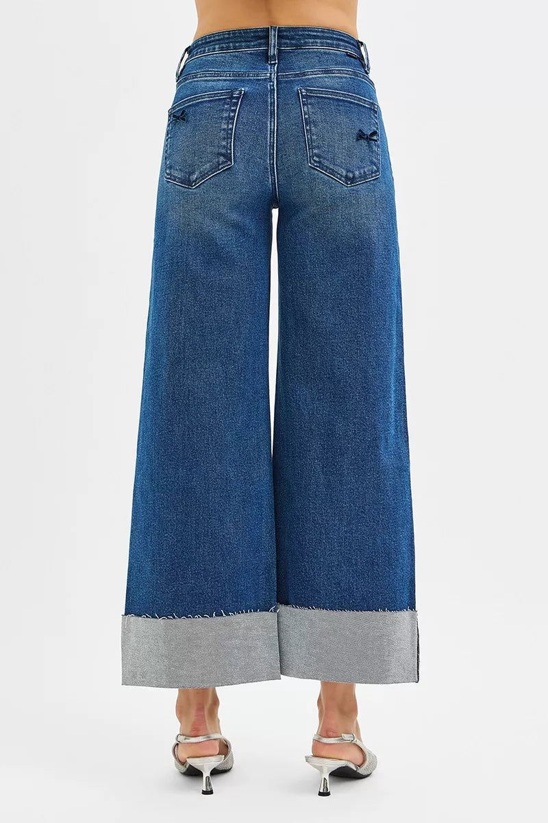NEWYORKLISTED STYLE COLLECTION: Blue wide-leg jeans with gray hem on a white background