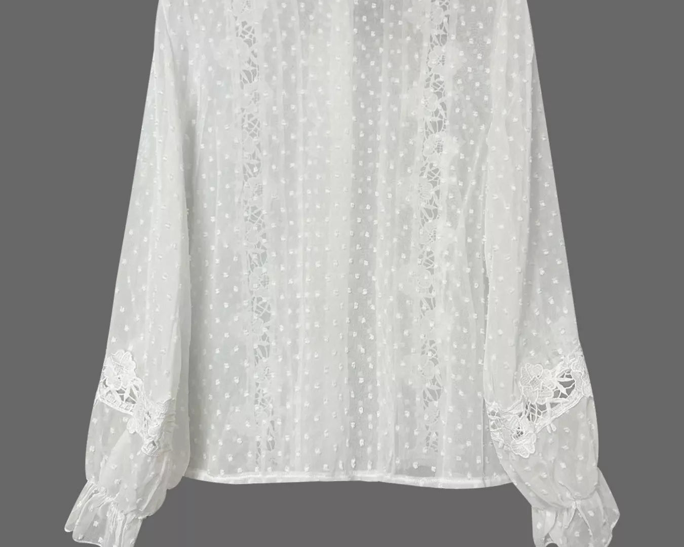 NEWYORKLISTED STYLE COLLECTION: White lace blouse on a gray background