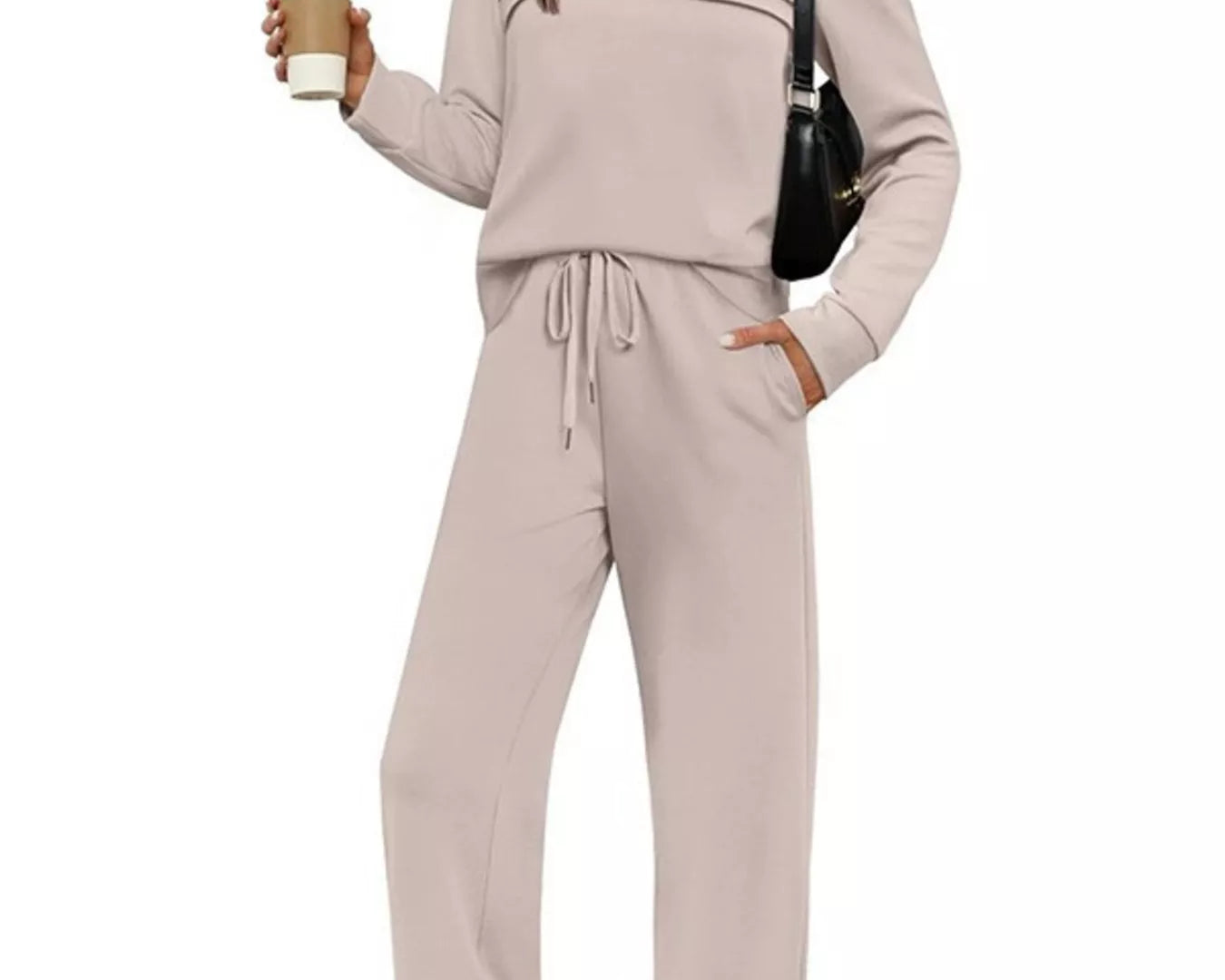 NEWYORKLISTED COMFORT COLLECTION: Woman wearing a beige lounge set holding a coffee cup on a white background