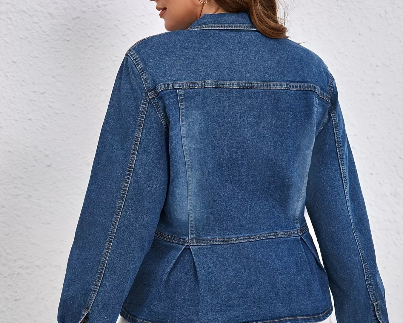 NEWYORKLISTED STYLE COLLECTION: Person wearing a blue denim jacket and white pants against a light gray background