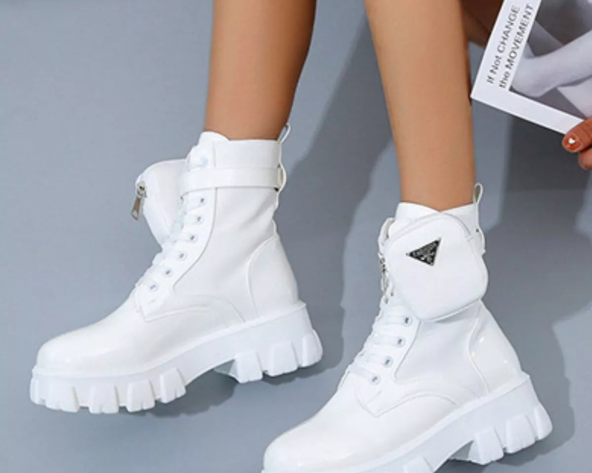 NEWYORKLISTED SHOE COLLECTION: White platform boots worn by a person on a gray background