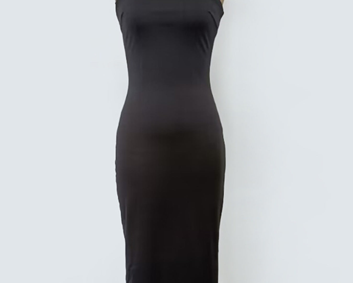 NEWYORKLISTED STYLE COLLECTION: Black dress on a mannequin against a white background