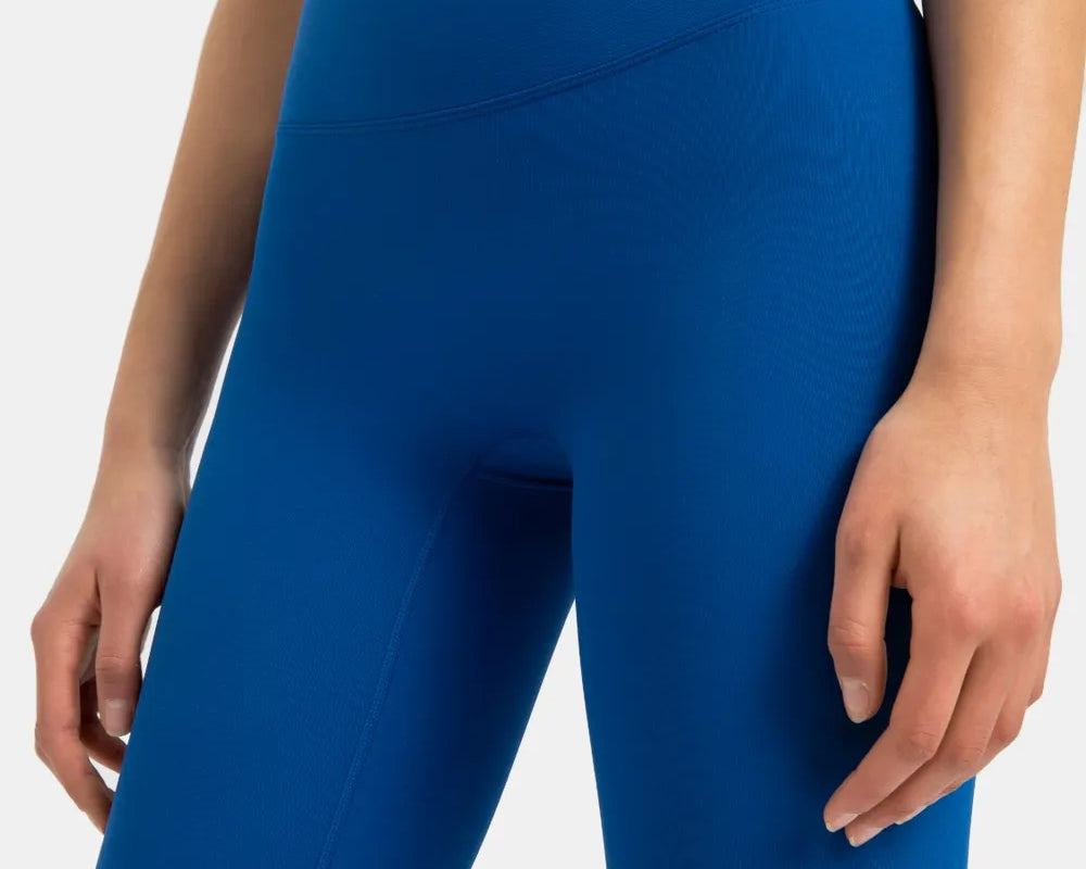 NEWYORKLISTED ACTIVEWEAR COLLECTION: Blue athletic shorts worn by a person on a white background